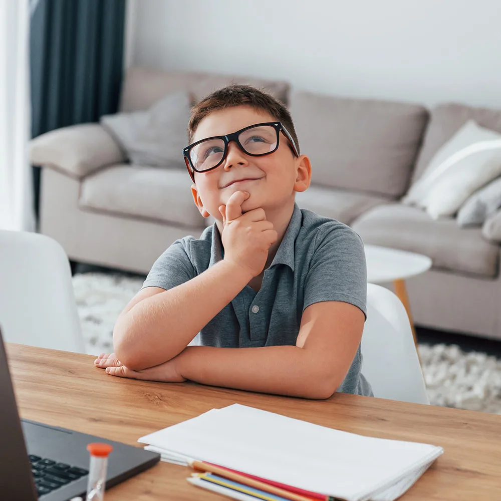 Child practicing a learning activity in a home setting